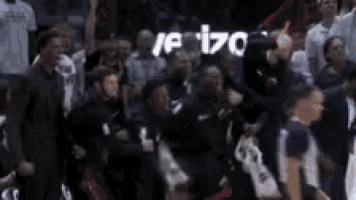 a crowd of people watching a basketball game with a scoreboard that says 170 .