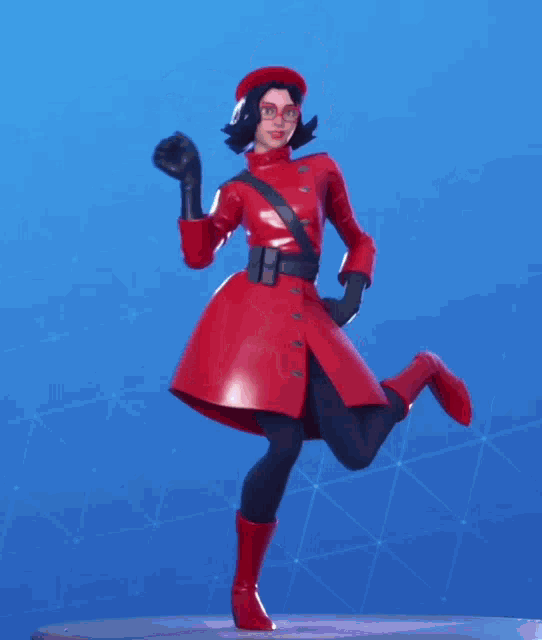 a woman in a red coat and red boots is standing on one leg