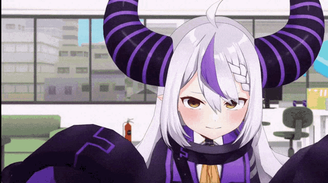 a cartoon character with purple horns and a letter t on her chest