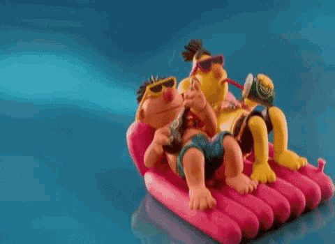 a couple of cartoon characters are laying on a pink raft