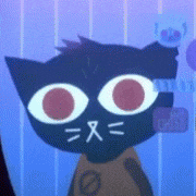 a black cat with red eyes and a cross on its nose