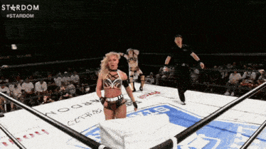 a woman in a wrestling ring with the word stardom written on it