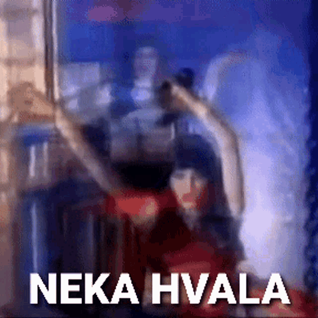 a blurred image of a man holding a gun with the words neka hvala below him