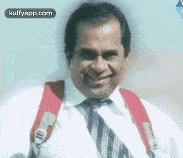 a man in a white shirt and tie is smiling and holding a backpack .