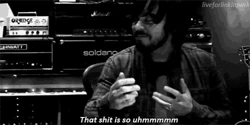 a black and white photo of a man with the words that shit is so uhmmmmm
