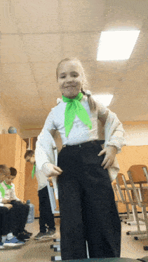 a girl with a green scarf around her neck