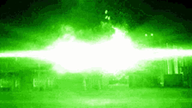 a green background with a white glowing light coming out of it .