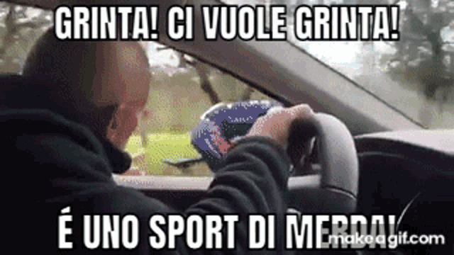 a man is driving a car with the words grinta ci vuole grinta written on the screen