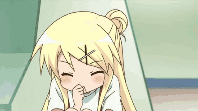 a cartoon girl with blonde hair is covering her mouth with her hands