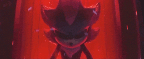 shadow the hedgehog from sonic the hedgehog is standing in a red room .