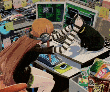 a cat sitting on a desk next to a girl with headphones on