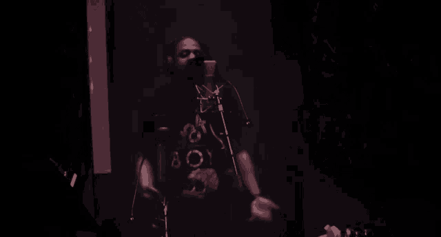 a man wearing a black shirt that says boy on it