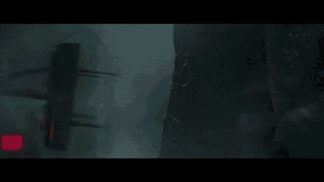 a dark room with a red sign that says ' apocalypse ' on it