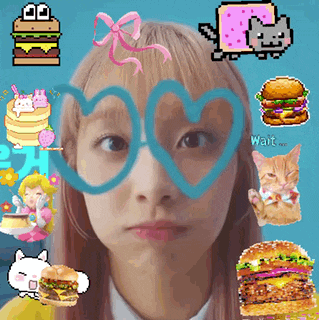 a girl wearing heart shaped glasses is surrounded by a bunch of stickers including one that says wait