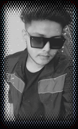 a young man wearing sunglasses and a black jacket