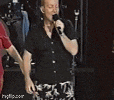 a man singing into a microphone with the website imgflip.com visible in the corner