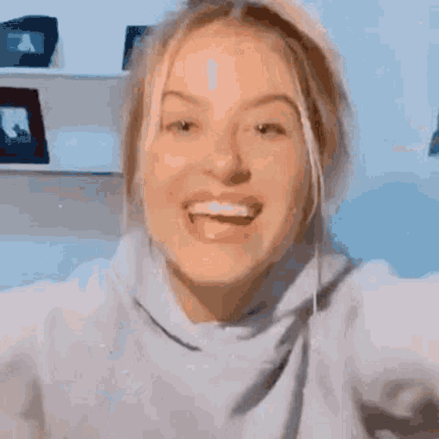a close up of a woman with her mouth open .