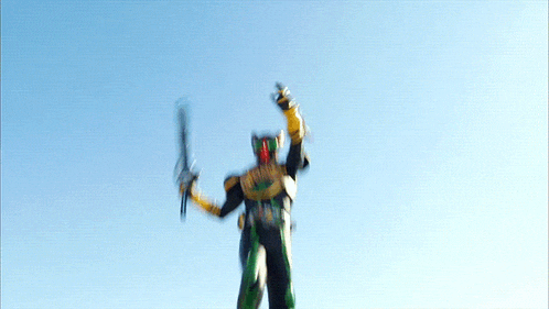 a man in a superhero costume jumps in the air
