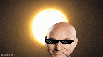 a bald man wearing sunglasses is smoking a cigarette in front of a sun
