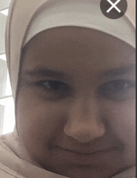 a close up of a person 's face with an x in the middle