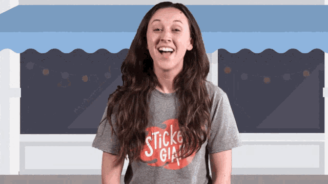 a woman wearing a gray t-shirt that says sticke girl