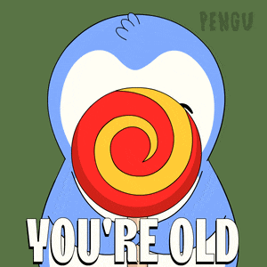 a penguin with a lollipop in its mouth and the words you 're old