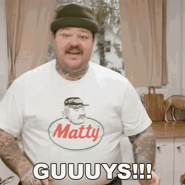 a man wearing a matty t-shirt says guuuys !!!