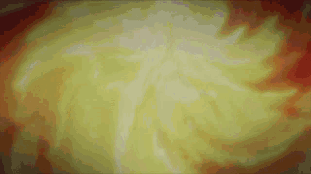 a yellow and red background with a swirl in the center