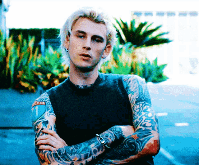 a man with a tattoo on his arm that says ' i love you '