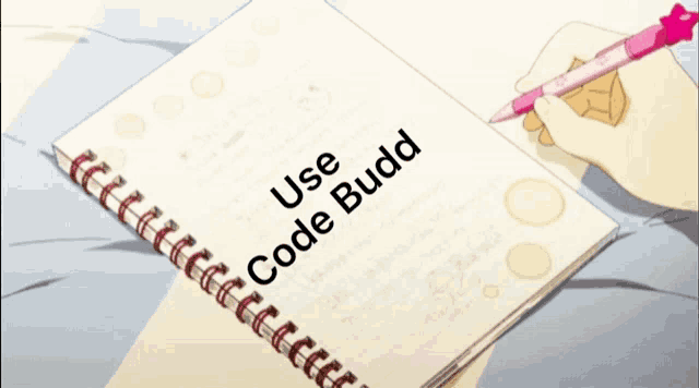 a person is writing in a notebook that says use code budd on it