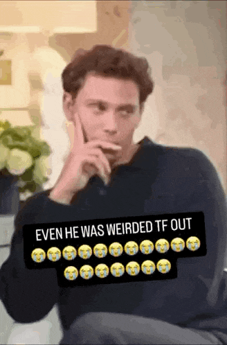 a man is smoking a cigarette in a room with a caption that says even he was weirded tf out