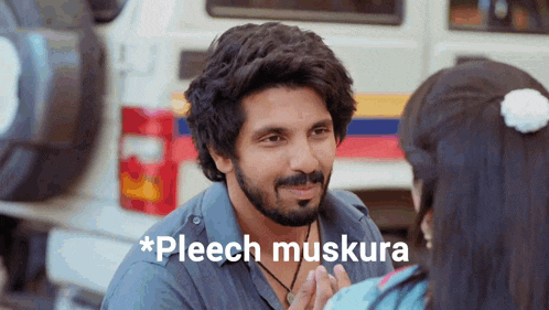 a man with a beard is talking to a woman with the words pleech muskura written on the bottom