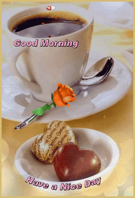 a cup of coffee with a rose on a saucer next to a bowl of heart shaped chocolates