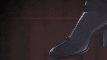 a close up of a person 's face and a shoe