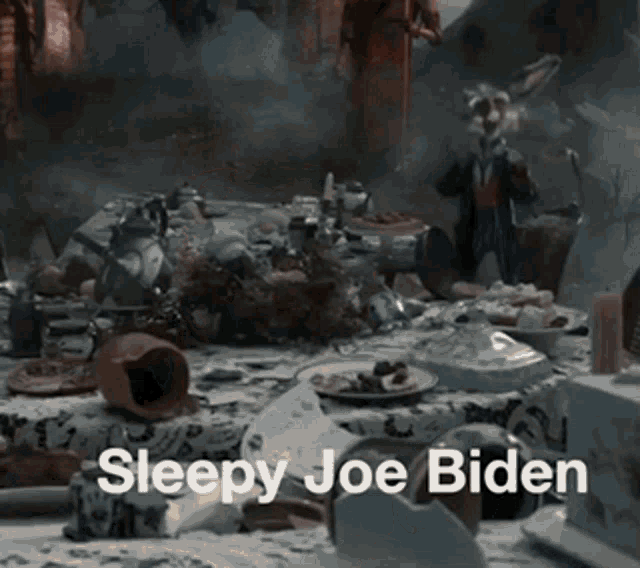 a table with a rabbit on it and the words sleepy joe biden below it