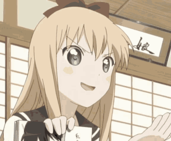a blonde anime girl holding a piece of paper with chinese writing
