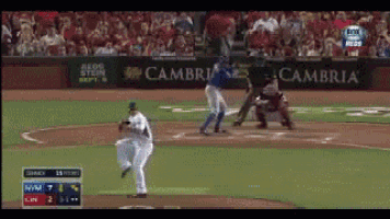 a baseball game is being played in front of a banner that says cambria