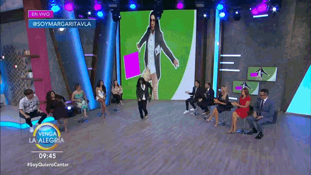 a group of people are sitting in front of a screen that says soymargaritavila