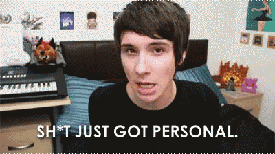 a man is making a funny face with the words " sh * t just got personal " below him
