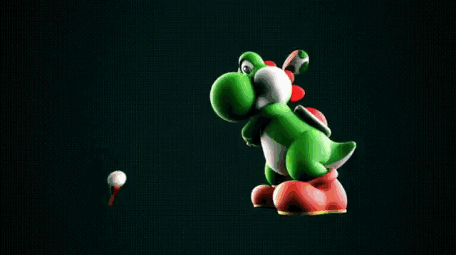 a green gummy bear is holding a sword in his hand .