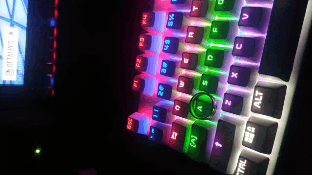 a close up of a colorful keyboard with the alt key in the middle