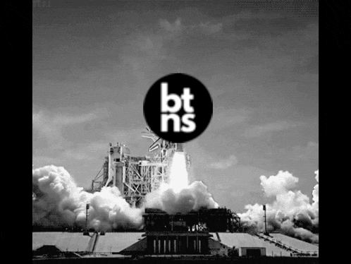 a black and white photo of a space shuttle being launched with the bt ns logo in the foreground