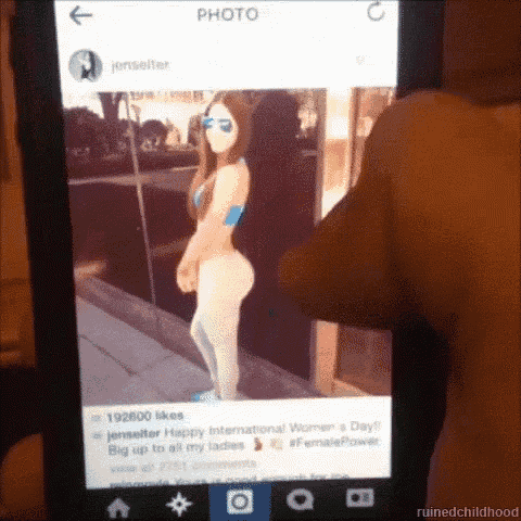 a person is taking a picture of a woman on a phone
