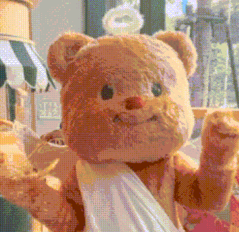a teddy bear with a bandage on its arm