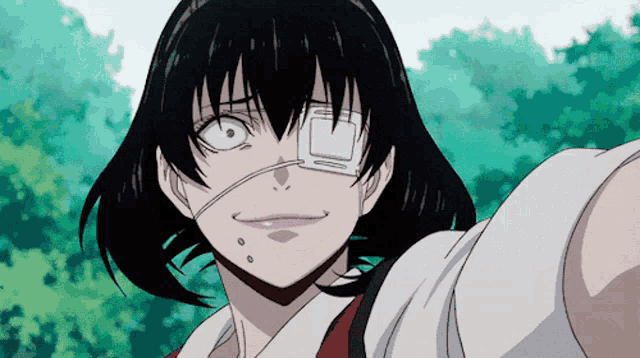 a girl with a bandage on her eye is smiling for the camera