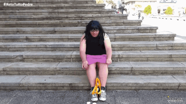 a woman sits on a set of stairs with the hashtag #retotuttopedro