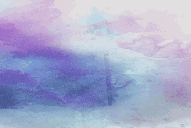 a purple and blue watercolor background with a few spots on it