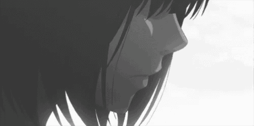 a black and white drawing of a girl 's face looking down