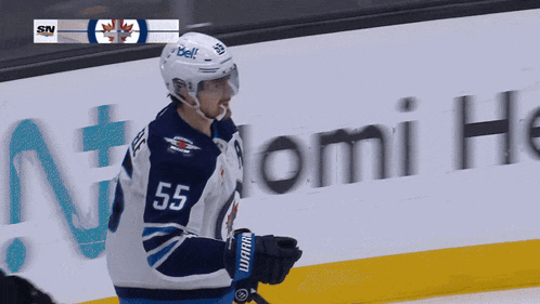 a hockey player with the number 55 on his shirt