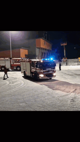 a red fire truck with the word scania on it